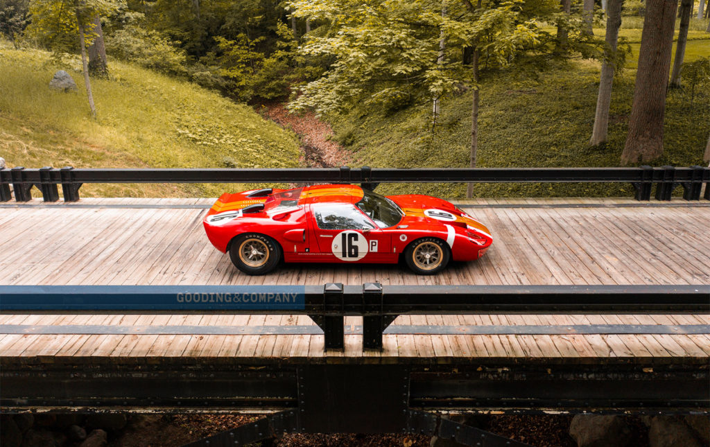 The Alan Mann GT-1 driving on a bridge.