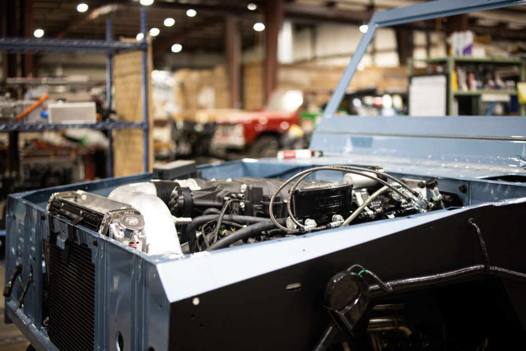 Gateway Bronco in assembly line getting engine installed.